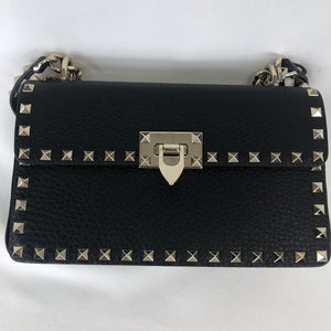 Black shoulder bag with rock stud detailing Gold-toned hardare featuring polished clasp and chain strap  100% calf leather construction Adjustable strap  Shoulder or handbag  5.5" x 9.5" x 2.5" Drop 19.5" - 23.5" Designer Style ID: QW1B0C15VSL  Made in Italy