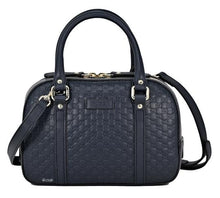 Load image into Gallery viewer, This bag is where functionality and high fashion meet in a beautiful mix! This small crossbody satchel is the perfect size to fit all your day to day needs, while still maintaining the luxury associated with the infamous Gucci brand. There are hand straps as well as a shoulder strap for comfort and inner pockets for prime organization. This navy bag will fit in with your wardrobe perfectly!