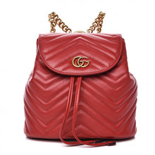 Load image into Gallery viewer, The Gucci Black Marmont Quilted Leather Backpack in Red features adjustable shoulder straps with post-stud fastening. Logo plaque at face. Fold over flap with magnetic tab fastening. Drawstring fastening at throat. Patch pocket and leather logo flag at interior. Leather lining in beige. Antiqued gold-tone hardware. Tonal stitching.