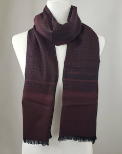 Salvatore Ferragamo Torres Scarf in Black Cherry will keep you soft and warm.  Light enough and just the right size for that added layer as a shawl and double it up around your neck to look stylish in the winter months.  The reds and blacks go with anything in your wardrobe.  Dress it up or wear it with jeans and your favorite T shirt.