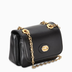 Gucci Marina Collection features grommet covered strap holes, a marina themed chain, and smooth polished interlocking GG magnetic closure.