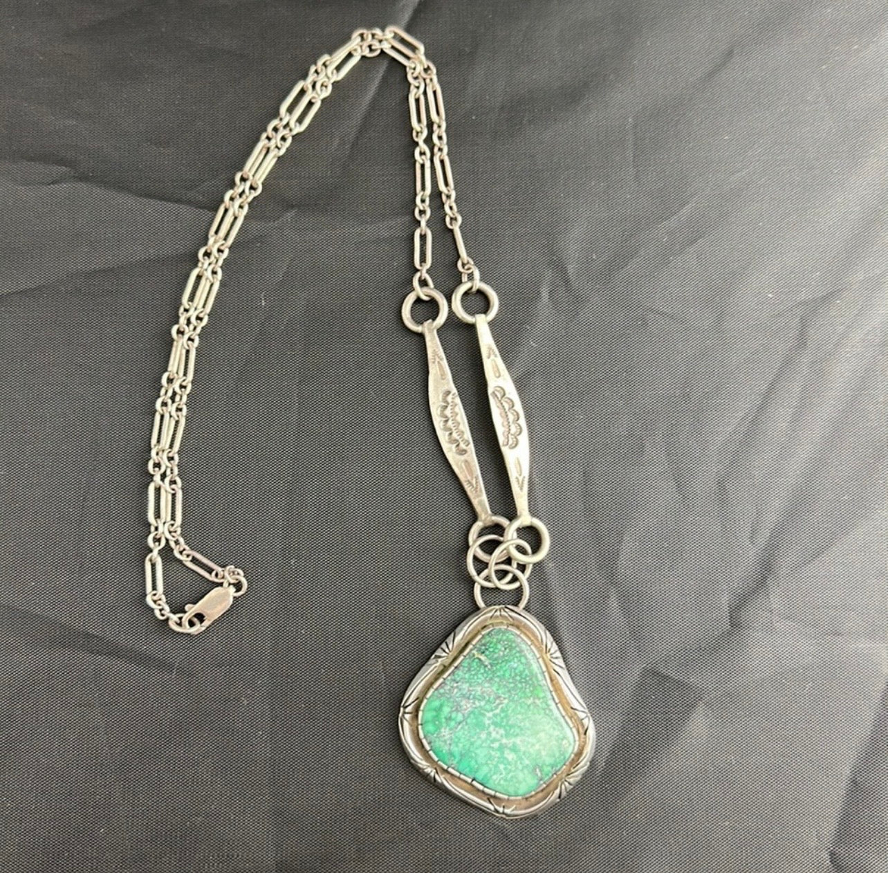 Sterling Silver and real turquoise artist stamped necklace.
Statement piece