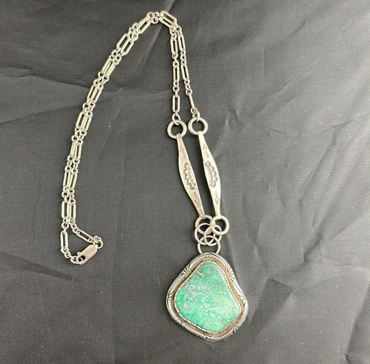 Sterling Silver and real turquoise artist stamped necklace.
Statement piece