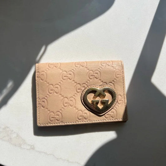 PREOWNED Gucci Beige Wallet with Gold Heart Logo