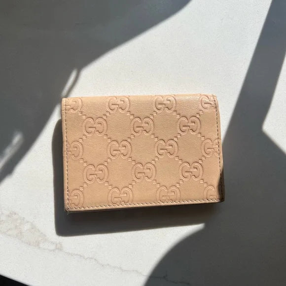 PREOWNED Gucci Beige Wallet with Gold Heart Logo