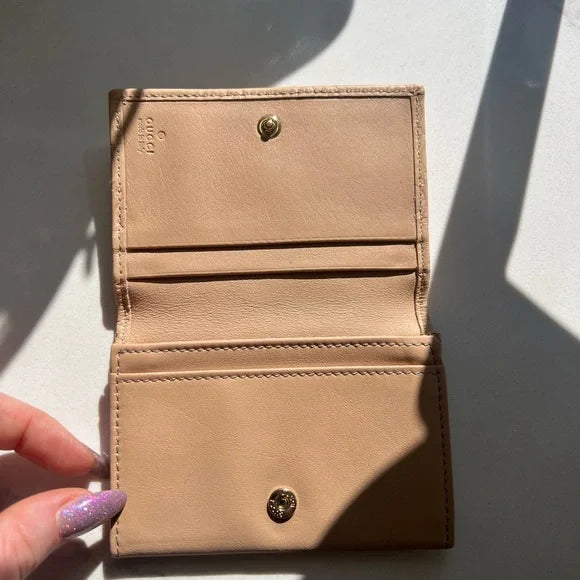 PREOWNED Gucci Beige Wallet with Gold Heart Logo