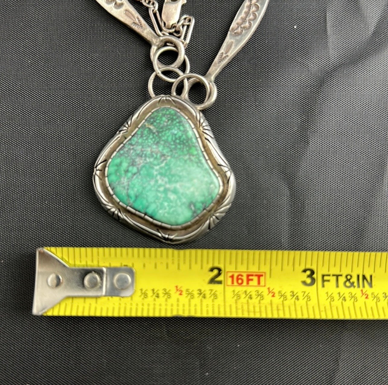 Sterling Silver and real turquoise artist stamped necklace.
Statement piece