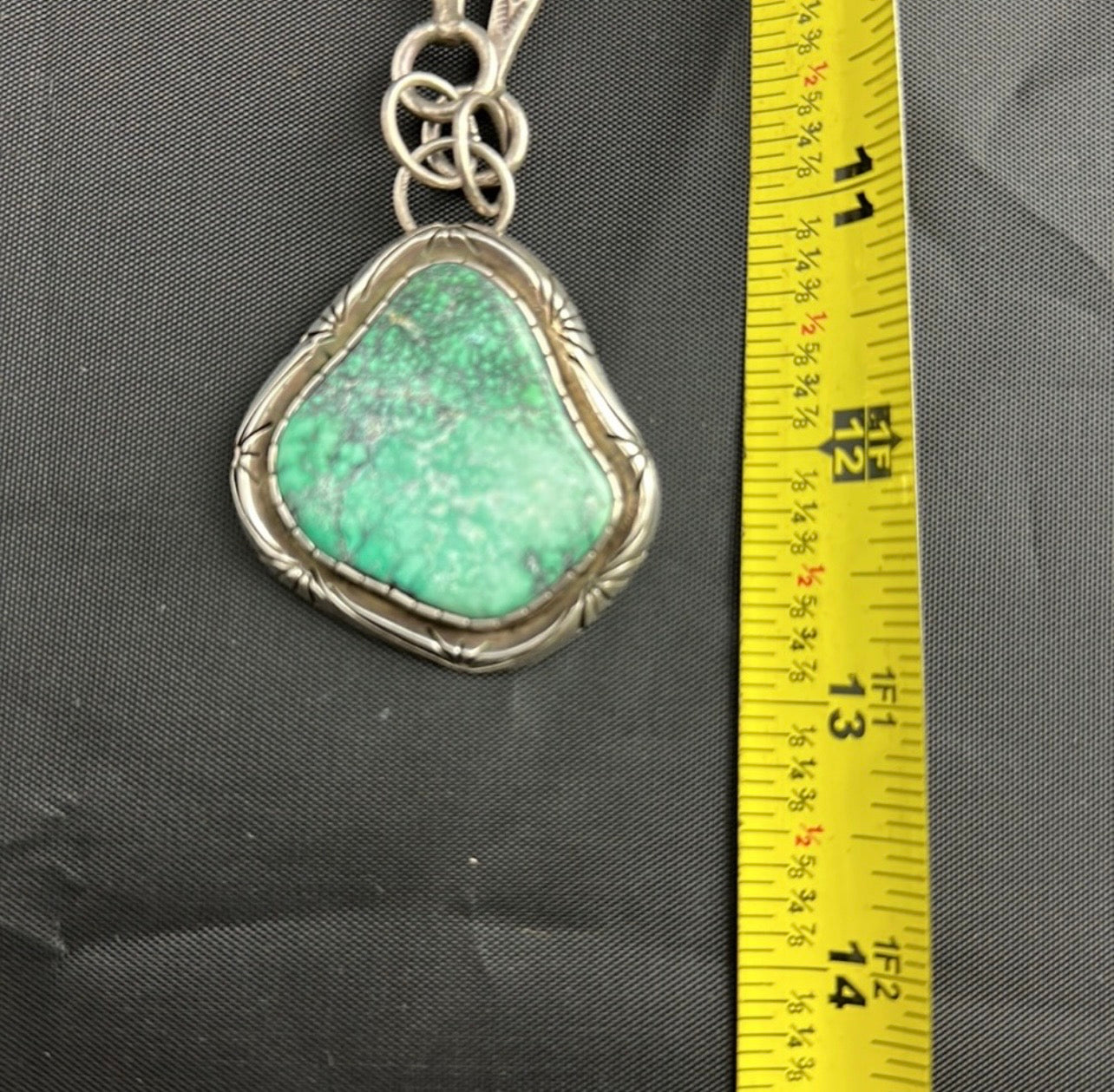 Sterling Silver and real turquoise artist stamped necklace.
Statement piece