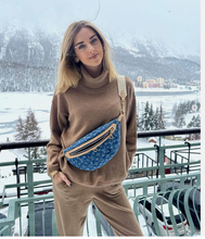 Load image into Gallery viewer, Louis Vuitton High Rise Monogram Denim Bag featured on a model with a snowy backscape.  She is wearing the bag across her left shoulder and under her right arm in the front.
