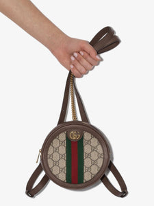 Gucci Ophidia collection backpack.  This bag is round with gold hardware and a leather and chain strap that can be worn as a backpack or over the shoulder.