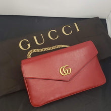 Load image into Gallery viewer, Red and black envelope bag Gold-toned hardware Classic GG emblem on red side Crystal tiger clasp laid on gold striped design on black side 100% Leather 10.5 x 6.25&quot; x 2&quot; Chain drop 5&quot; Strap drop 20-24&quot; Comes in Gucci dust bag Product number 808303758 Made Italy