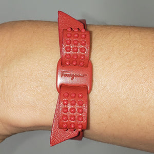 Lipstick red bracelet Signature vara bow with textured ridges Features Ferragamo logo at the center 100% leather snap closures 8" x 0.5" strap Adjustable snaps at 7.75" and 6.75" Product number 62061708 Made in Italy