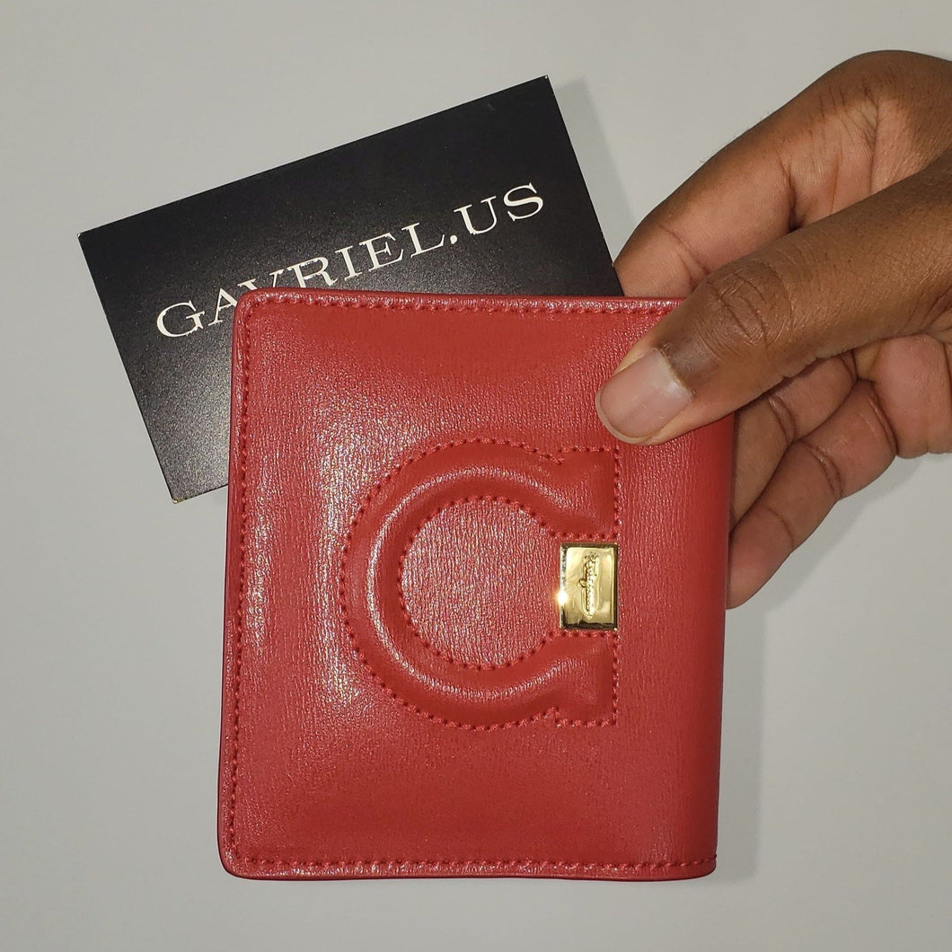 Lipstick red french wallet Gold hardware featuring Ferragamo logo  Signature quilted Gancini accent 100% calfskin logo Fabric lining Contrast leather gusset and lining details Snap flap closure 6 interior and 4 interior card slots 4.25