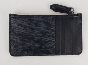 Black card holder Dark silver-toned hardware featuring Ferragamo name accent  100% pebbled leather 1 zipped pouch and 5 card slots 5.25" x 2.75" x 0.5" Product number 0670661 Made in Italy 