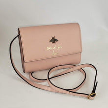 Load image into Gallery viewer, Are you blind for love? Well we are, and our sights are set on this adorable Gucci crossbody bag! Made in perfect pink with an adorable gold bee accent and &quot;blind for love&quot; lettings, this small purse is a great addition to your look! Supple leather comes together with a snap closure for a simplistic, elegant design. The interior is spacious enough to hold your beloved devices, and also has 4 card slots to keep you organized. Add this cute crossbody to your collection!