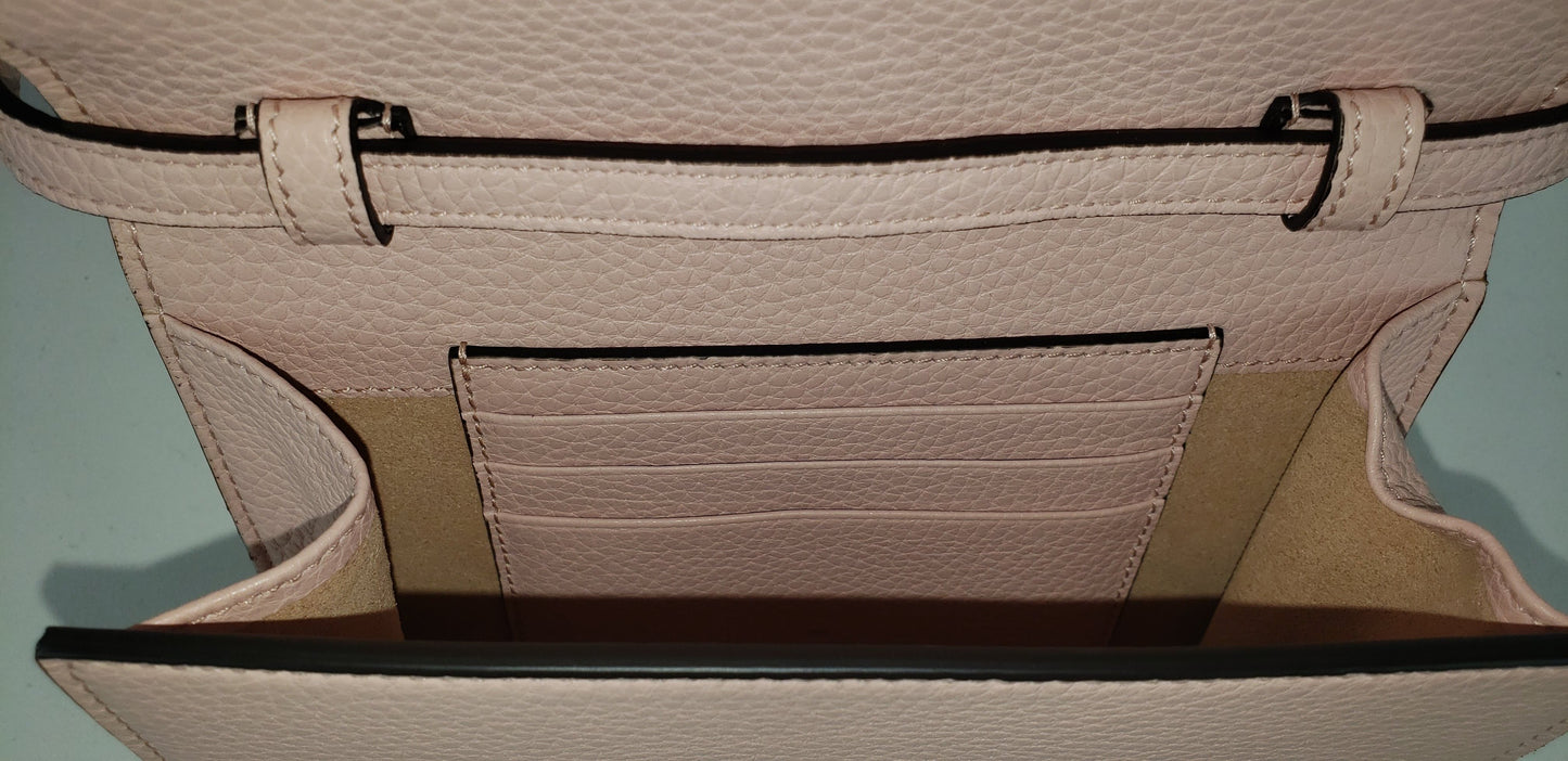 Made in Perfect Pink with an adorable gold bee accent and "blind for love" lettering, this small purse is a great addition to your look! Supple leather comes together with a snap closure for a simplistic, elegant design. The interior is spacious enough to hold your beloved devices, and also has 4 card slots to keep you organized. Use as a crossbody bag or remove the strap and use it as a clutch.