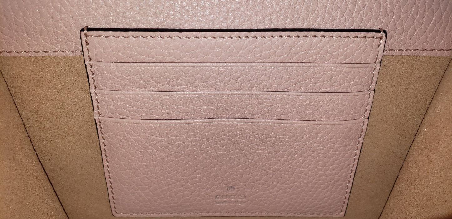 Made in Perfect Pink with an adorable gold bee accent and "blind for love" lettering, this small purse is a great addition to your look! Supple leather comes together with a snap closure for a simplistic, elegant design. The interior is spacious enough to hold your beloved devices, and also has 4 card slots to keep you organized. Use as a crossbody bag or remove the strap and use it as a clutch.