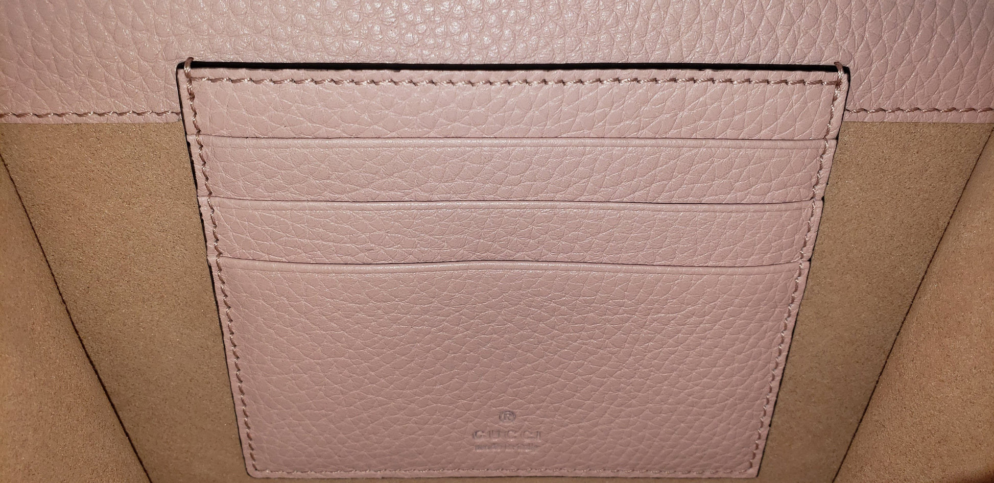 Made in Perfect Pink with an adorable gold bee accent and "blind for love" lettering, this small purse is a great addition to your look! Supple leather comes together with a snap closure for a simplistic, elegant design. The interior is spacious enough to hold your beloved devices, and also has 4 card slots to keep you organized. Use as a crossbody bag or remove the strap and use it as a clutch.