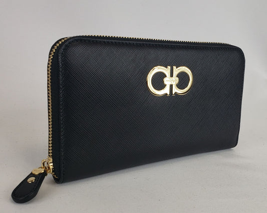 This Salvatore Ferragamo is a whole new level of luxury. With smooth calfskin leather and sleek gold accents, this accessory will go with almost anything. Three interior compartments and eight card holders allow you to encase your belongings in the lap of luxury and organization. This wallet will protect your prized possessions without sacrificing style and design! 