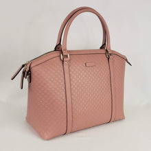 Load image into Gallery viewer, This light pink Gucci Dome Handbag is absolutely adorable and is great for everyday wear or traveling. In a muted, gorgeous color that will match with jeans or a dress, this bag is great for any occasion. It is especially versatile with its adjustable and detachable shoulder strap so you can rock it as a handbag or shoulder bag!