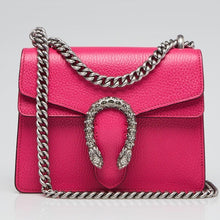 Load image into Gallery viewer, The Gucci Mini Dionysus Shoulder Bag in Pink is a show stopping, rare must have. The top flap is secured with a textured spear head tiger, which references the mystical and powerful god Dionysus and his journey across the Tigris river on the back of the animal. This accent is further enhanced by carefully placed blue Swarovski crystals. 