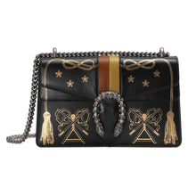 Load image into Gallery viewer, The Gucci Small Dionysus Shoulder Bag in Black is illuminated with metallic prints inspired by Promenade Des Alyscamps. The sliding chain strap can be worn multiple ways, changing between a shoulder and a top handle bag. Black leather Silver-toned hardware Orange and yellow stripe Metallic ancient cemetery symbolism, stars and tassel print Crystal details at the closure Viscose lining Pin closure with side release Tiger head closure Hand-painted edges Interior zippered compartment Open pocket under the flap