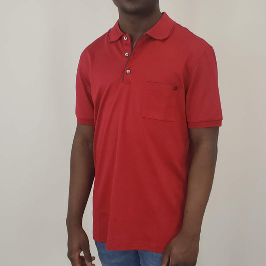 Red polo shirt 100% cotton  3 white buttons traditional neck collar breast pocket with Ferragamo logo accent Product number H121782 Made in Italy