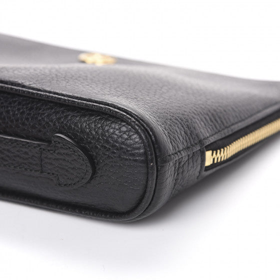 The Gucci Calfskin GG Marmont Pouch in Black is crafted of lovely textured calfskin leather in black. This bag features a top zipper that opens to a beige fabric interior with a zipper pocket and card slots on one side and a single pouch pocket on the opposite.