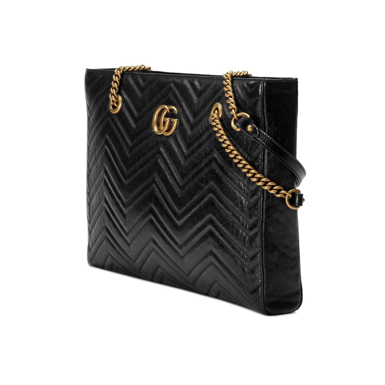 The Gucci GG Marmont Matelassé Leather Shoulder Bag in Black is a gorgeous leather bag with a tote silhouette which is accented by antique gold-tone hardware. Exquisite matelasse stitching accentuates the streamlined silhouette of a trim tote bag branded with antiqued double-G hardware inspired by an archival design.