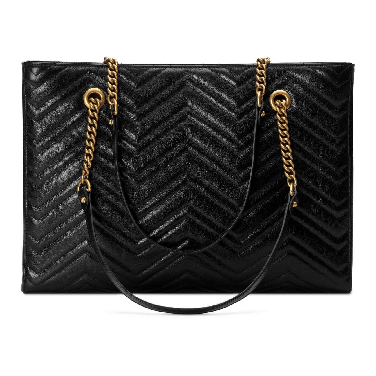 The Gucci GG Marmont Matelassé Leather Shoulder Bag in Black is a gorgeous leather bag with a tote silhouette which is accented by antique gold-tone hardware. Exquisite matelasse stitching accentuates the streamlined silhouette of a trim tote bag branded with antiqued double-G hardware inspired by an archival design.