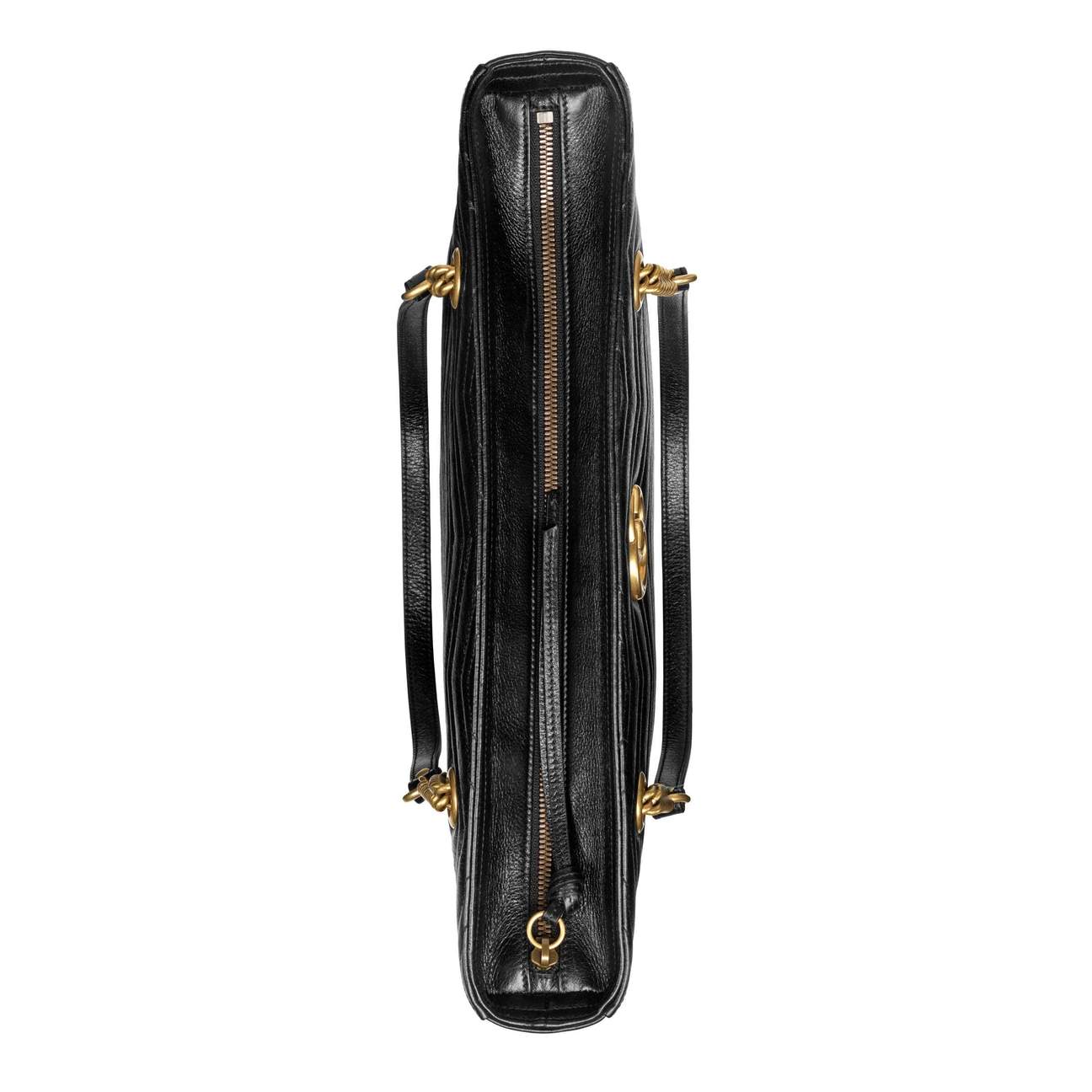 The Gucci GG Marmont Matelassé Leather Shoulder Bag in Black is a gorgeous leather bag with a tote silhouette which is accented by antique gold-tone hardware. Exquisite matelasse stitching accentuates the streamlined silhouette of a trim tote bag branded with antiqued double-G hardware inspired by an archival design.