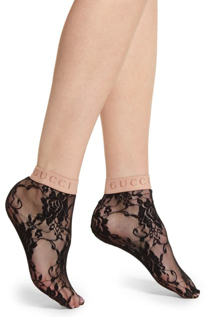 Gucci lace ankle socks with a  pale nude logo elastic top.  A fresh look on an ankle sock.