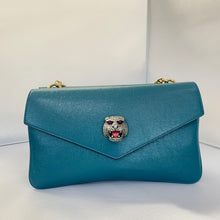 Load image into Gallery viewer, This is a two toned, double sided Gucci bag. The style is called Thiara and it looks like two envelopes back to back. One side is a mellow Robin blue. The other side is a jade green. The blue side has a jewel encrusted Raja tiger head on the magnetic clasp. The green side has the iconic double GG on the button clasp. There is a fixed Gucci gold short chain on the top and a strap is also included to make this a should bag or crossbody.