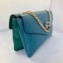 Load image into Gallery viewer, This is a two toned, double sided Gucci bag.  The style is called Thiara and it looks like two envelopes back to back.  One side is a mellow Robin blue.  The other side is a jade green.  The blue side has a jewel encrusted Raja tiger head on the magnetic clasp.  The green side has the iconic double GG on the button clasp.  There is a fixed Gucci gold short chain on the top and a strap is also included to make this a should bag or crossbody.