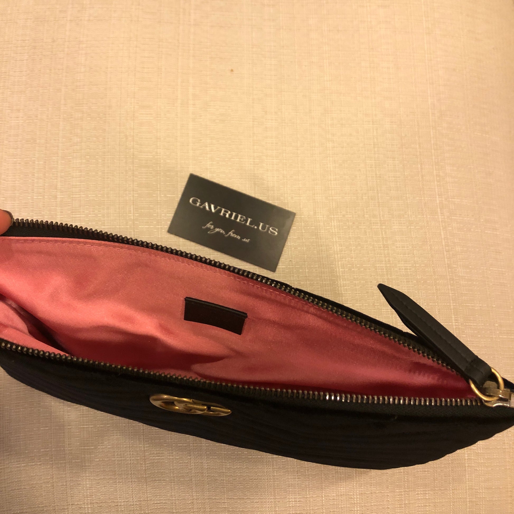 The Gucci Marmont Matelesse Velvet Zip Pouch is plush velvet textured with exquisite matelasse stitching enhances the statement-making style of a trim zip-top pouch that can double as a chic clutch. Gilded GG hardware inspired by an archival design adds a signature finishing touch.