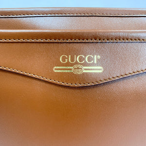 Gucci Metallic Print Logo Smooth Leather Clutch in Brown