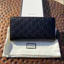 Load image into Gallery viewer, Gucci Interlocking GG Embossed Leather Zip Around Wallet in Black