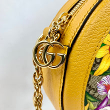 Load image into Gallery viewer, Yellow Ophidia GG Flora round crossbody bag Flora patterned body Beige interior lining  Gold-toned hardware  GG Supreme canvas Leather trim, accents, and strap Signature Gucci web GG logo accent at top and small charm 7.5&quot; x 7.5&quot; x 1.75&quot; Strap drop 22.75&quot; Product number 550618 Made in Italy 