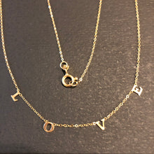 Load image into Gallery viewer, We love LOVE.  This 14k gold necklace has the word &quot;LOVE&quot; spelled out on a delicate chain.  A perfect wayt o express yourself or give a gift to the one you love.