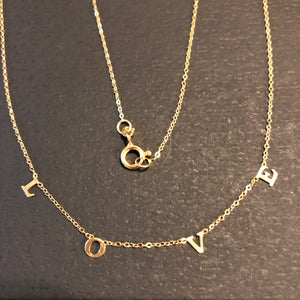 We love LOVE.  This 14k gold necklace has the word "LOVE" spelled out on a delicate chain.  A perfect wayt o express yourself or give a gift to the one you love.