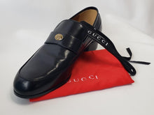 Load image into Gallery viewer, Supple black leather is carefully stitched to perfection in these Gucci Mens Loomis loafers. These fashionable shoes are made with the finest materials and dawn the signature Gucci logo. With an elongated toe, leather lining, and leather outsole, these shoes form to your foot for the upmost comfort and style. 