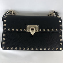 Load image into Gallery viewer, Black shoulder bag with rock stud detailing Gold-toned hardare featuring polished clasp and chain strap  100% calf leather construction Adjustable strap  Shoulder or handbag  5.5&quot; x 9.5&quot; x 2.5&quot; Drop 19.5&quot; - 23.5&quot; Designer Style ID: QW1B0C15VSL  Made in Italy
