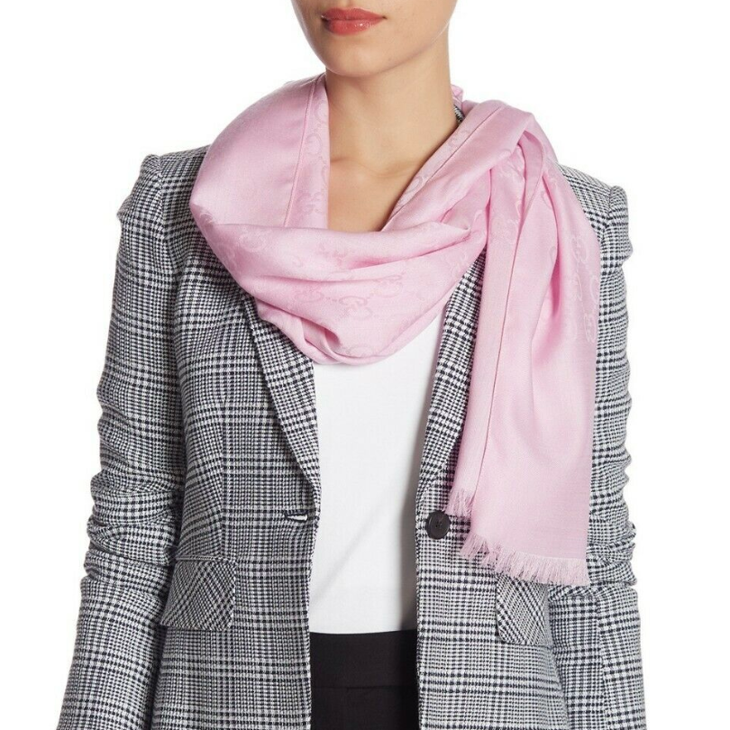 Gucci delivers a timeless and classic scarf in Rose Pink.  Wrap it around your neck for a neutral winter rose or use it as a blooming pink shawl in the spring.  This wool / silk scarf can be worn year round.