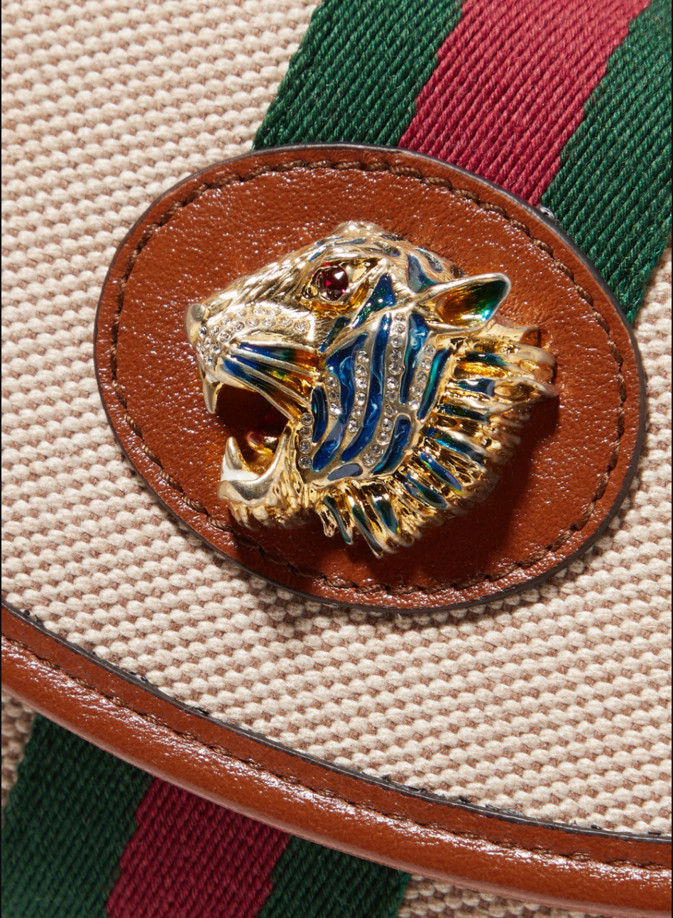 Beige Rajah mini shoulder bag Brown trim and interior  Gold-tone hardware  100% supreme canvas  Leather trim and interior  Signature red and green Gucci web Lions head embellished with blue, red, and white crystals  Fold over top with magnetic snap closure  Removable gold chain strap 2 card cases  4.5" x 7" x 1.5" Strap drop 22" Product number 573797 Made in Italy 