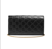 Load image into Gallery viewer, Black Padlock Continental Wallet on a Chain Gold-tone hardware 100% embossed leather  Top flap with padlock clasp closure Interlocking GG pattern  Removable chain strap  Made to be a clutch, handbag, and wallet  5 bill slots, 12 credit card slots, and 1 zippered compartment 4&quot; x 7.5&quot; x 2&quot; Strap drop 7&quot; Product number 453506 Made in Italy 