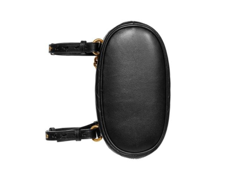 The Gucci Black Marmont Quilted Leather Backpack features adjustable shoulder straps with post-stud fastening. Logo plaque at face. Fold over flap with magnetic tab fastening. Drawstring fastening at throat. Patch pocket and leather logo flag at interior. Leather lining in beige. Antiqued gold-tone hardware. Tonal stitching.