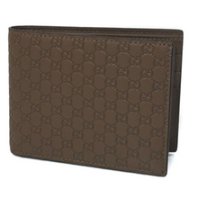 Load image into Gallery viewer, Gucci camel color leather bifold men’s wallet. Perfect size for your everyday needs. It boasts the beautiful GG embossed finish for a timeless style that you&#39;ll love year after year. With six credit card slots, one coin pocket, and one bill compartment, all of your cards, cash, and coins can be easily accessed and stored. Make this Gucci piece your go-to wallet!