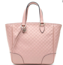 Load image into Gallery viewer, This Gucci GG Logo Microguccissima Soft Pink handbag is so cute and perfect for everyday. This beautiful pink is sure to add a chic neutral color to any everyday look. The inside has two credit card slots and one zip pocket. This Gucci handbag also includes a Gucci tassel along with a removable/ adjustable strap. Includes authenticity cards and Gucci dust bag. Made in Italy. 