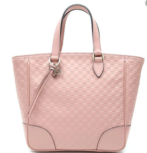 This Gucci GG Logo Microguccissima Soft Pink handbag is so cute and perfect for everyday. This beautiful pink is sure to add a chic neutral color to any everyday look. The inside has two credit card slots and one zip pocket. This Gucci handbag also includes a Gucci tassel along with a removable/ adjustable strap. Includes authenticity cards and Gucci dust bag. Made in Italy. 