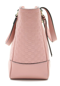 Made of GG Micro-Guccissima Leather Color: Soft Pink Top zip closure with Light Gold Hardware Fabric Interior Lining; Detachable / Adjustable shoulder strap Measurements: Height: 8; Depth: 4; Strap Drop: 19-21; Width: 7.75 Inches Made in Italy Includes authenticity cards and Gucci dust bag.